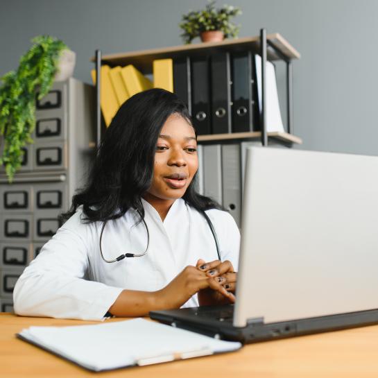African American female physician taking continuing education course online