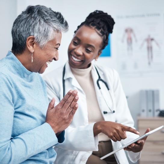 Female African American doctor having discussion with patient