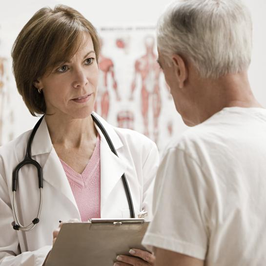 A doctor talks with her patience about incontinence and diabetes