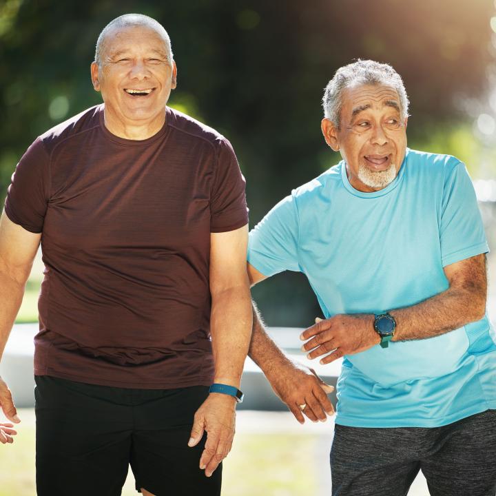 two senior men out for a fitness walk