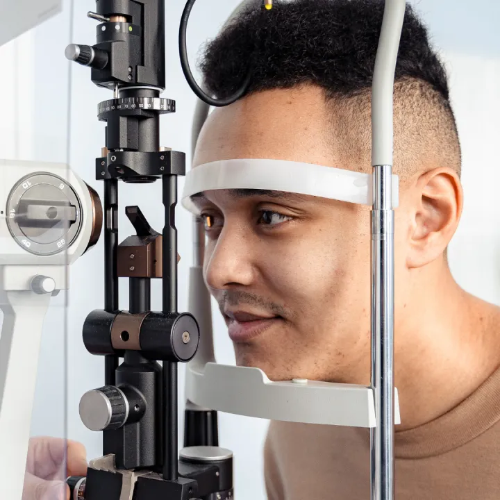A man gets his eyes examined for diabetes eye disease