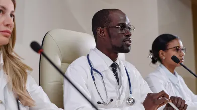 African American physician on a panel