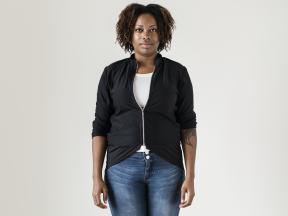 African American woman in jeans standing up