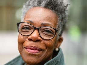 Smiling senior African American woman with glasses