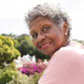 Smiling senior African American woman in garden