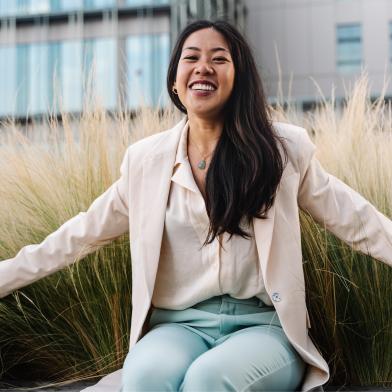 Smiling woman sitting on bench