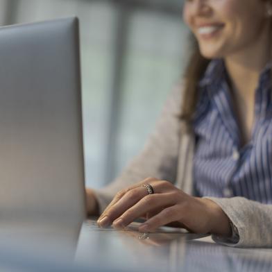 Woman at computer registering for a conference