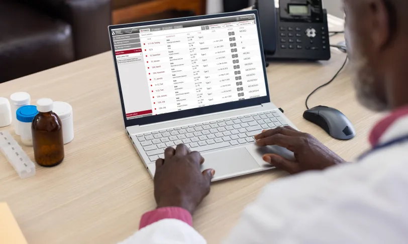 Physician looking at Chronicle Diabetes electronic health record