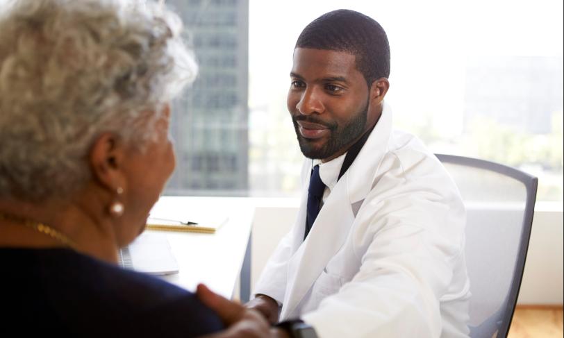 African American physician talking to patient