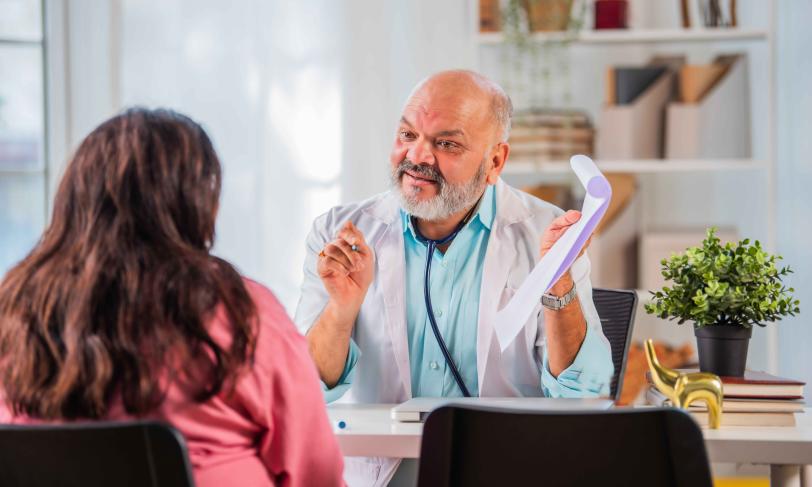 South Asian physician talking to patient