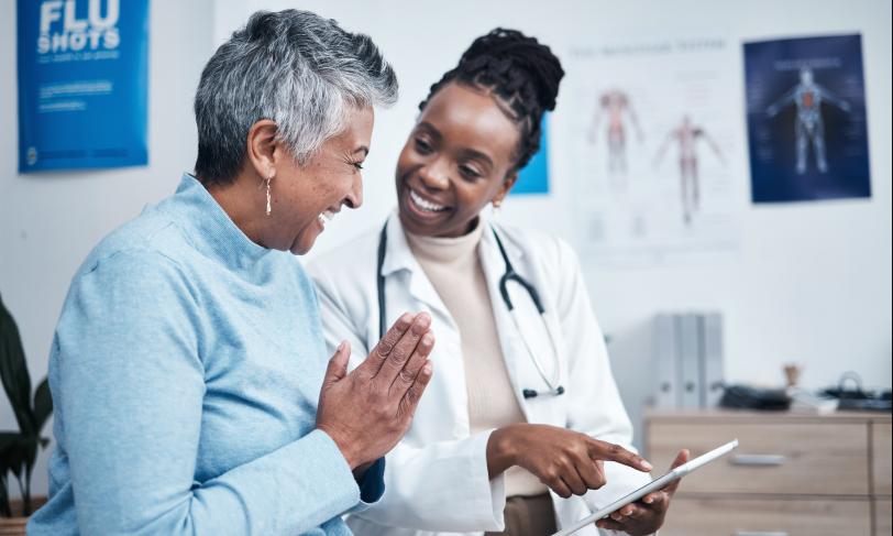Female African American doctor having discussion with patient