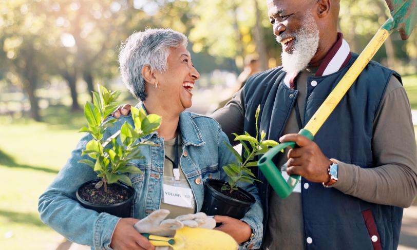 Senior man and woman doing yard work