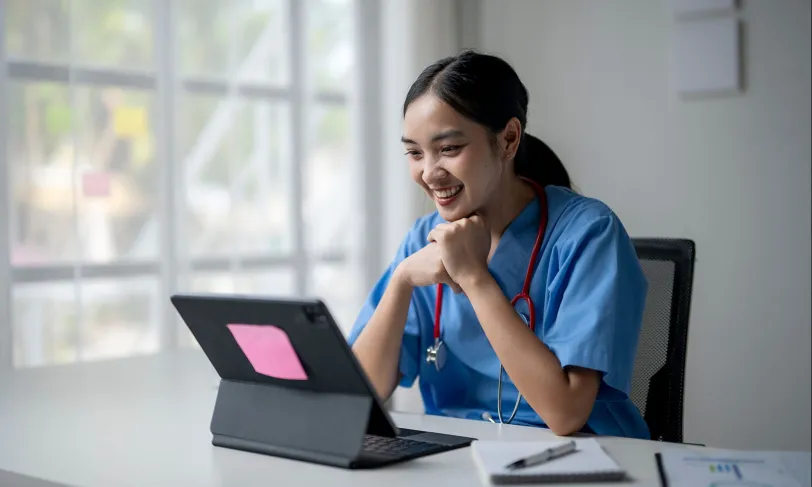 Smiling researcher looking at computer