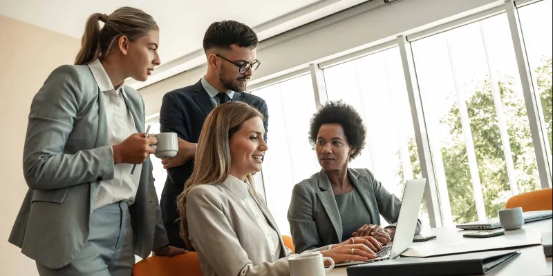 Group of business people at desk programs initiatives