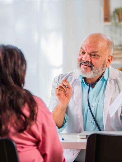 South Asian physician talking to patient
