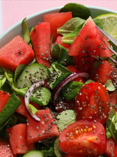 watermelon salad with tomatoes in bowl