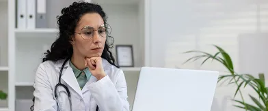 Hispanic female researcher watching a webinar